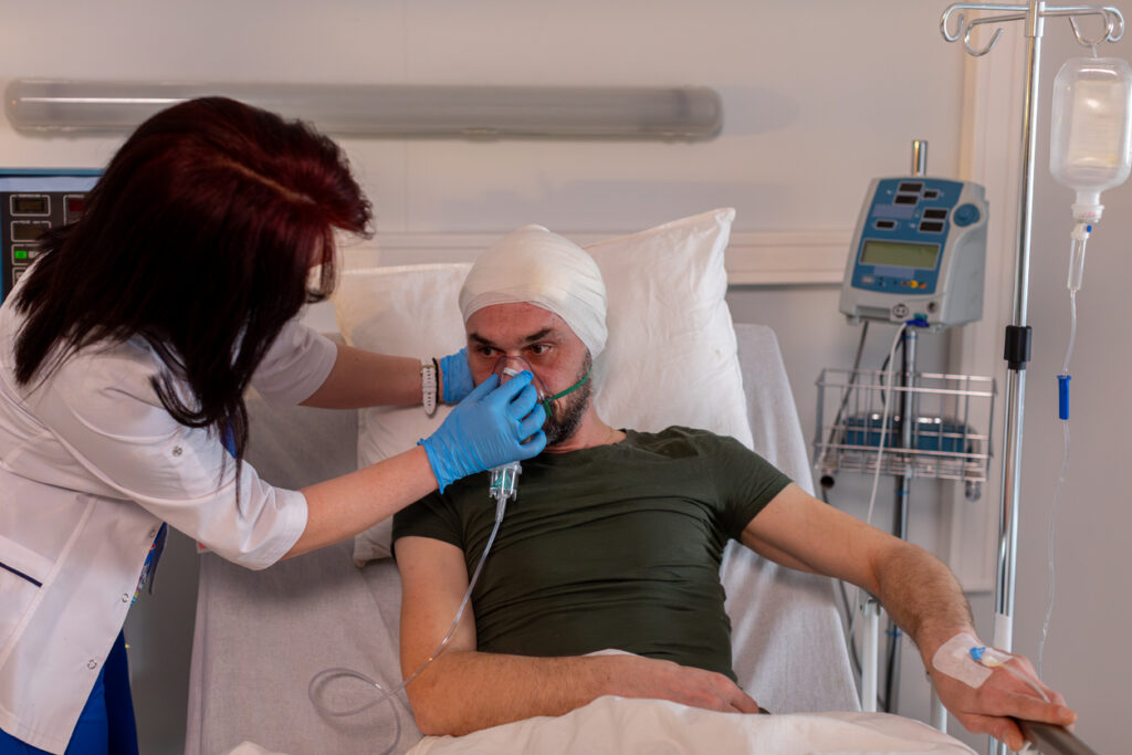 A nurse provides assistance to a patient