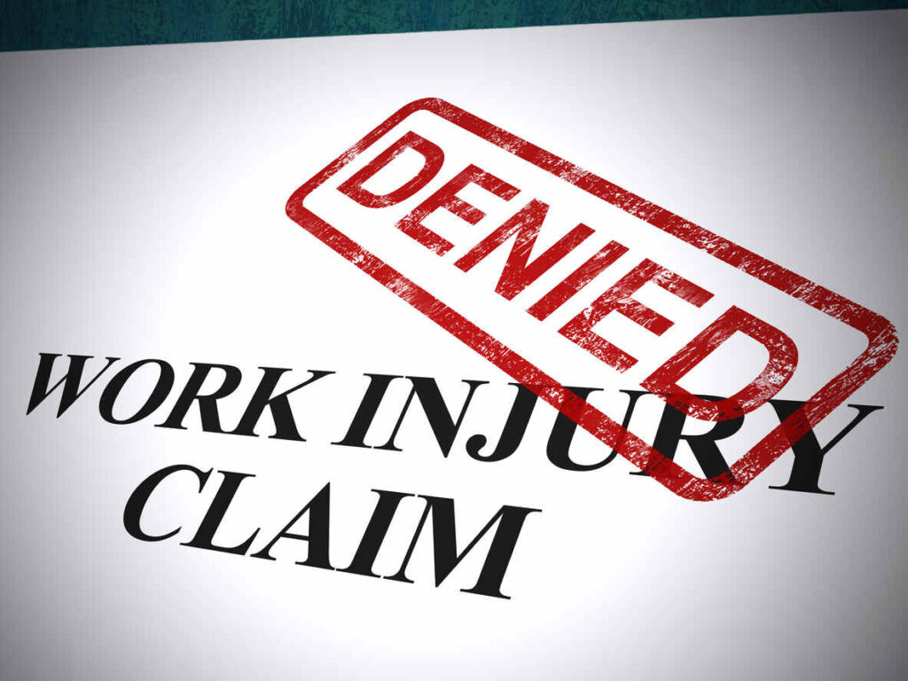 A document showing 'WORK INJURY CLAIM' with a red 'DENIED' stamp, symbolizing a rejected workers' compensation claim.